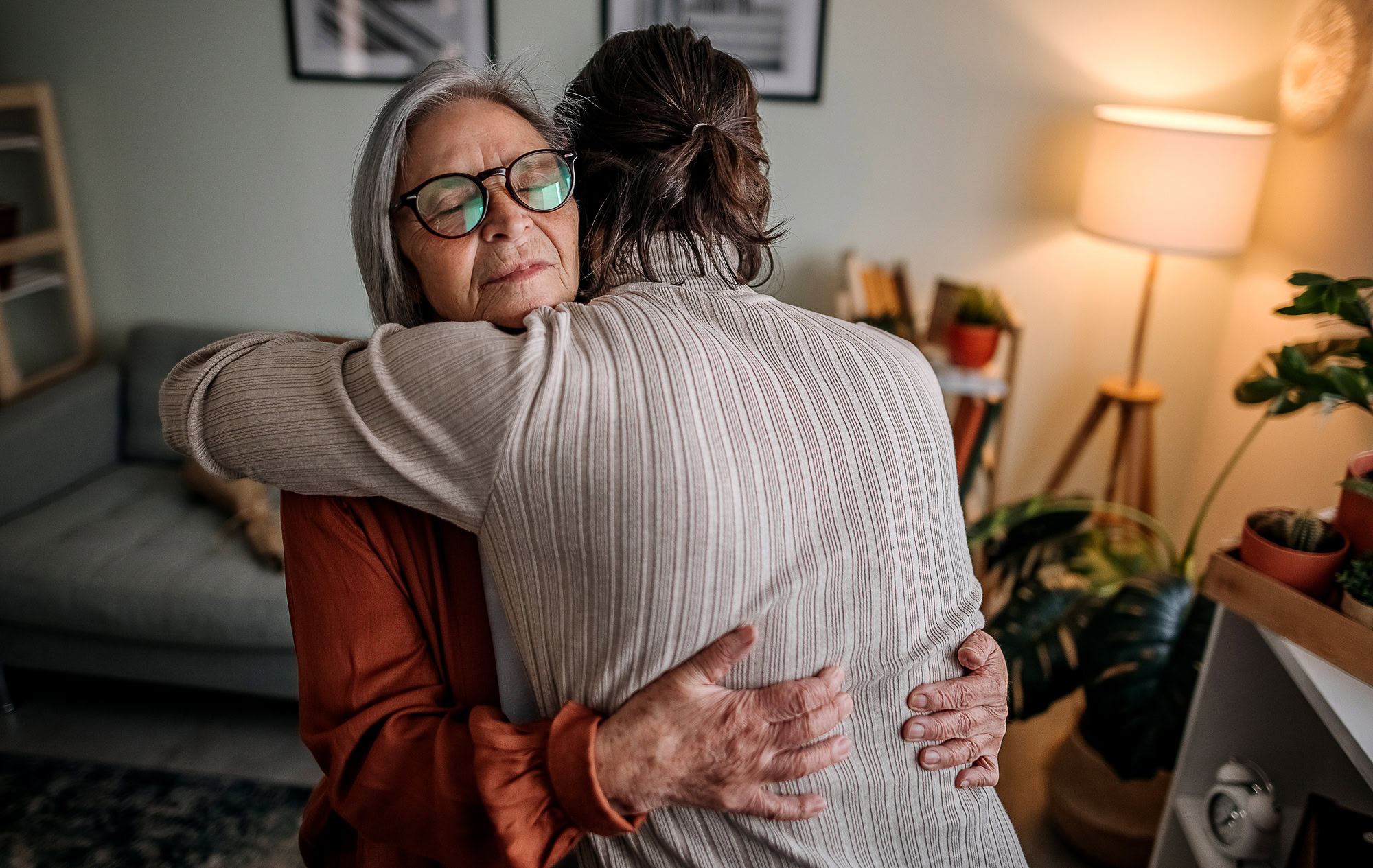 A mother and daughter embrace