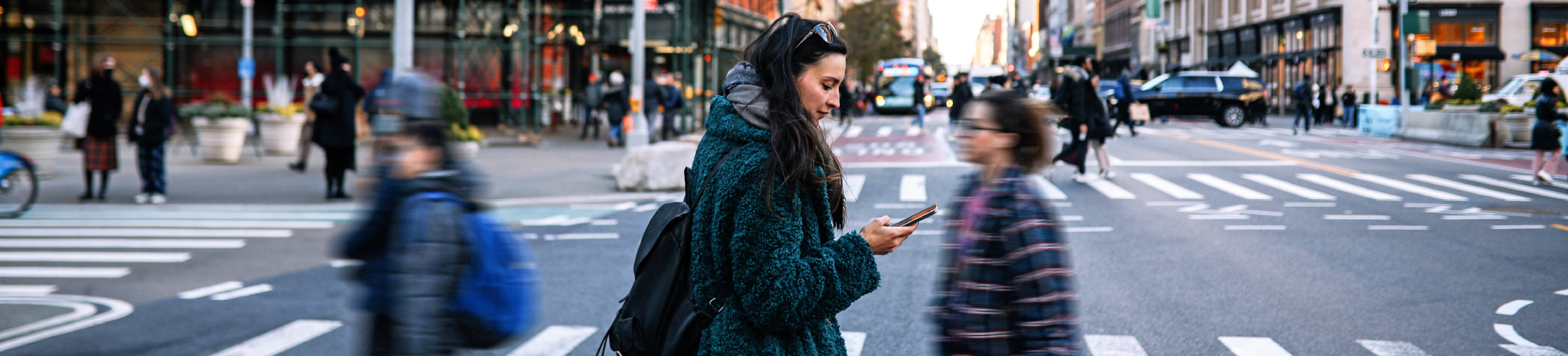 woman-walking-across-street-tall