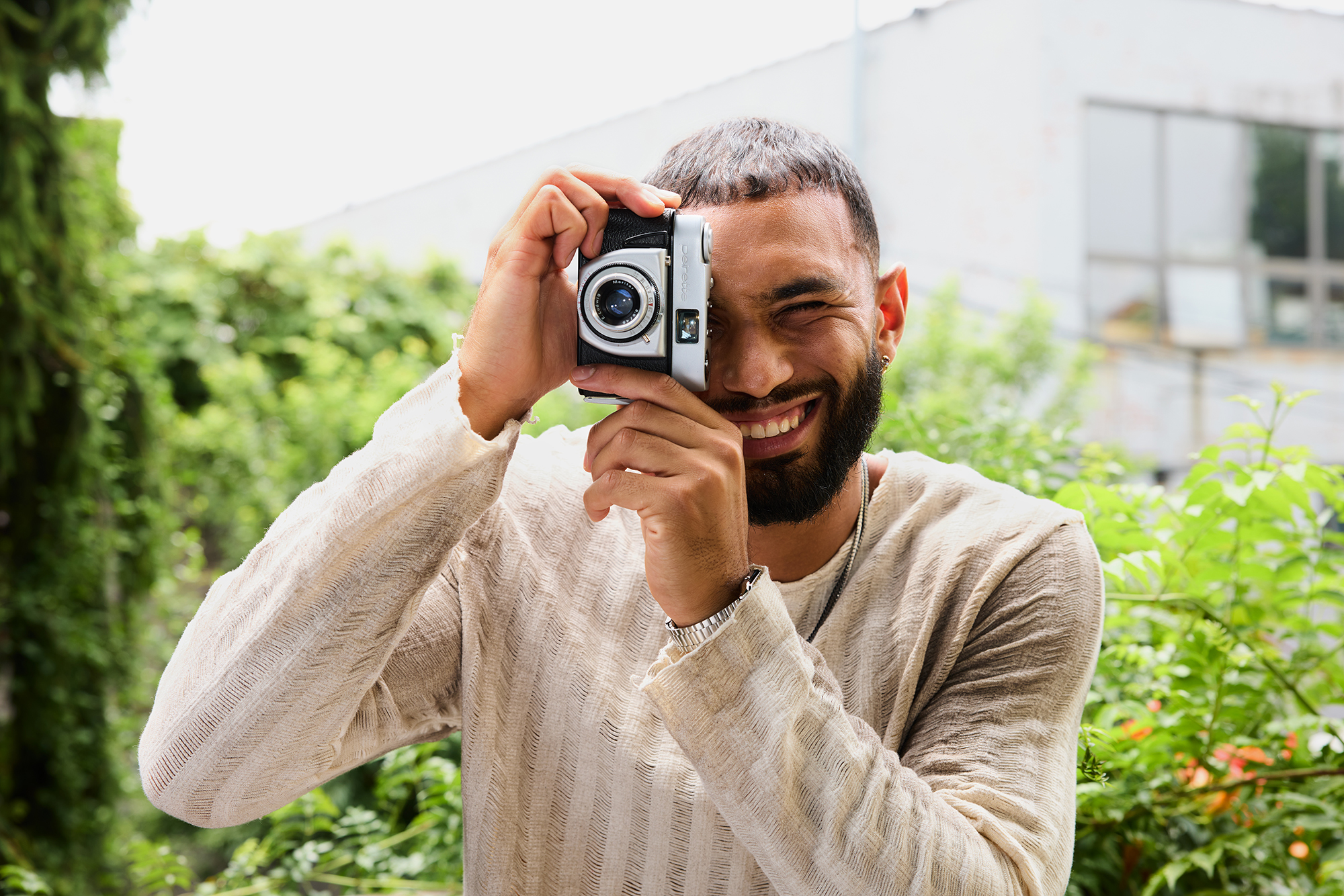 man taking a photograph with a camera